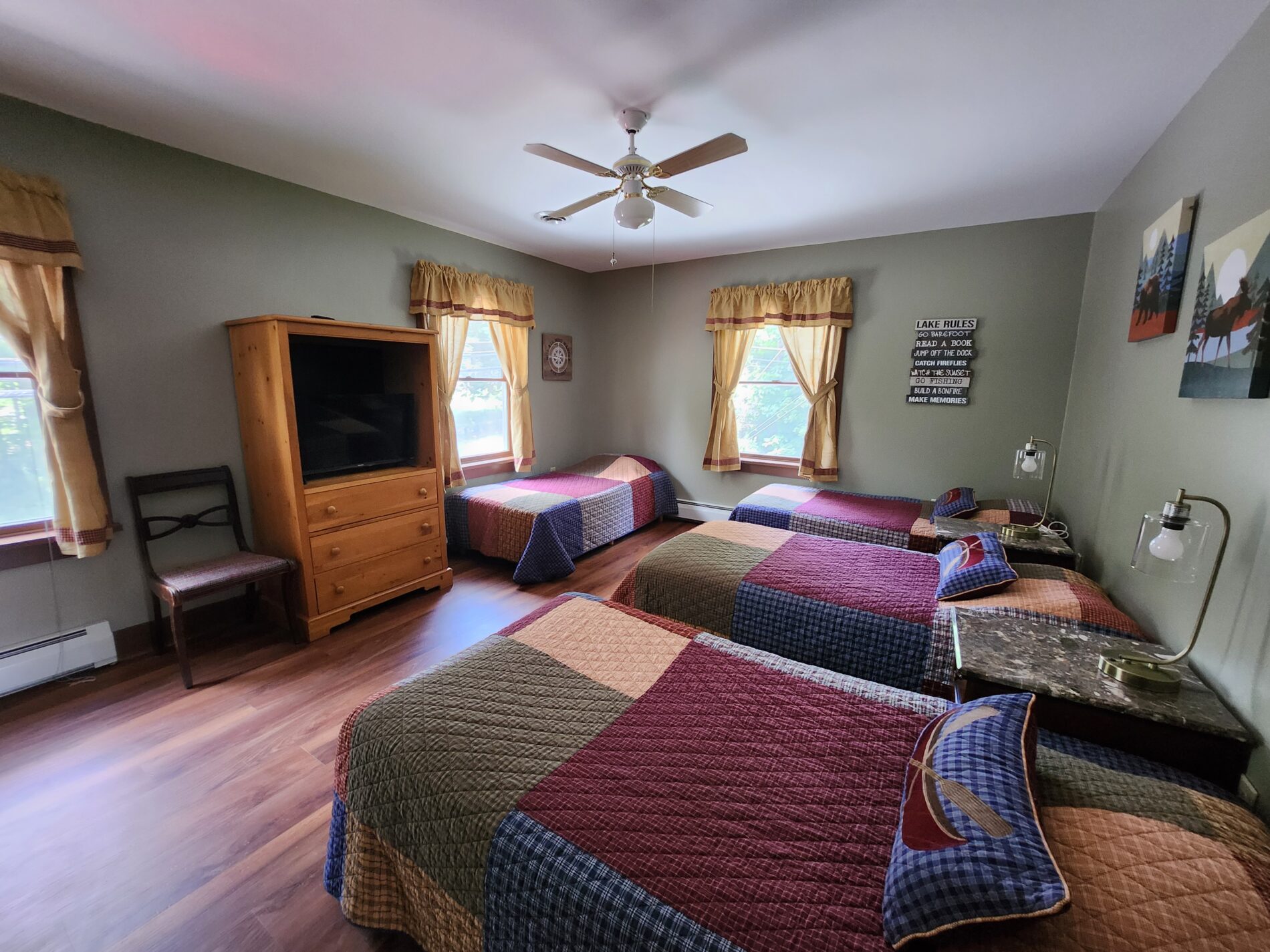 view with four beds neatly made