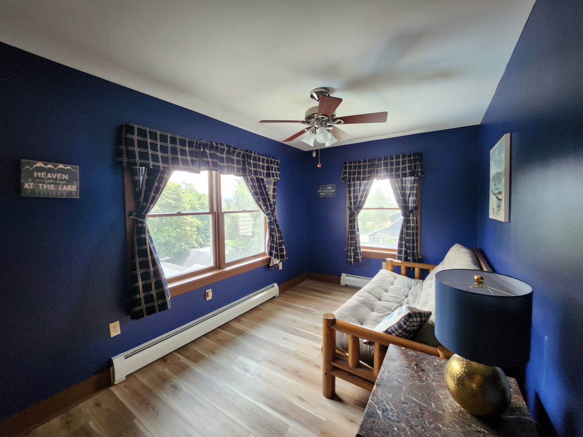 couch in front of window with curtains